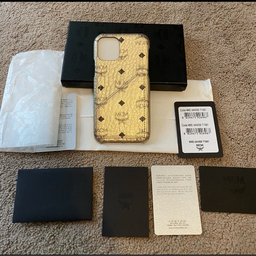 NWT MCM iPhone 11 Pro case in Berlin gold color w/card slot.